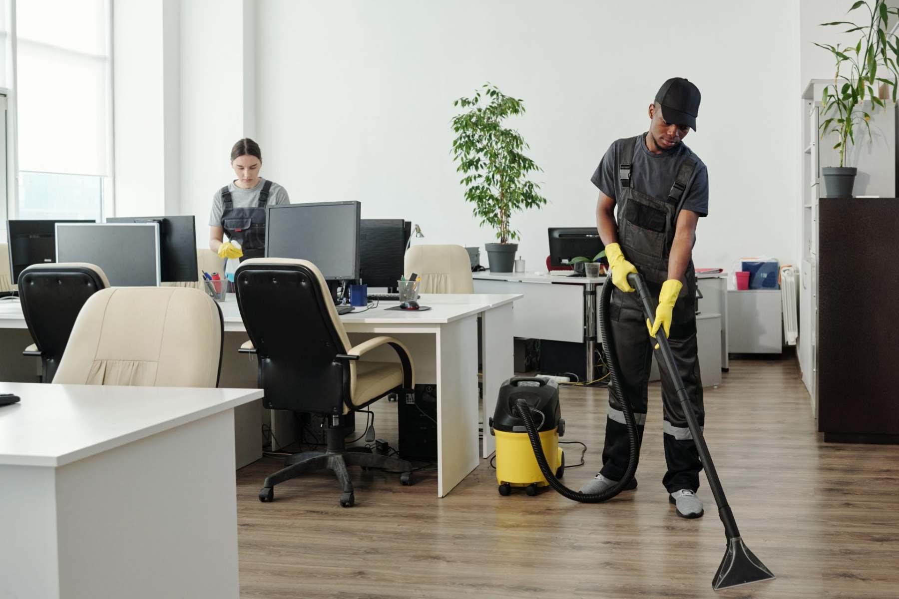 young-african-american-man-in-workwear-cleaning-fl-2022-04-29-00-28-58-utc